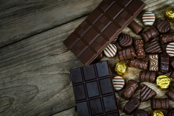 Variety of sweet homemade chocolate pralines and chocolate bars