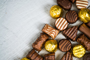 Variety of sweet homemade chocolate pralines and chocolate bars