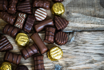 Variety of sweet homemade chocolate pralines and chocolate bars