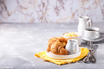 Breakfast - croissant, egg and coffee. Selective focus. Copy space