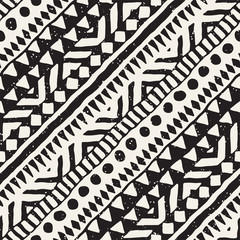 Black and white tribal vector seamless pattern with doodle elements. Aztec abstract art print. Ethnic ornamental hand drawn backdrop.