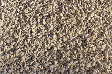 Beige coarse gravel.