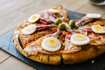 Close-up of sliced pizza with eggs