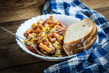 Pieces of sausage fried with egg.