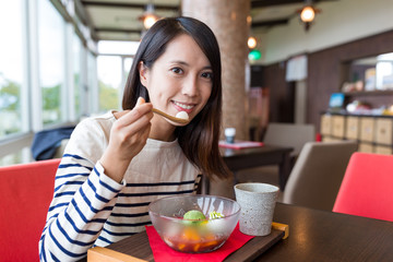 Woman enjoy japanese dessert