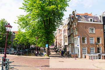 Naklejka premium Traditional Amsterdam buildings and canals