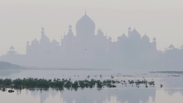Jumna river and Taj Mahal at sunrise in Agra, India.