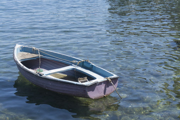 Small rustic rowing fishing boat 