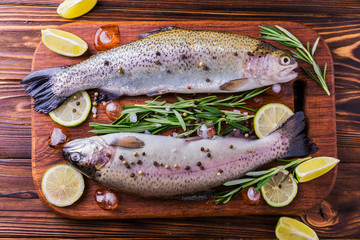 Seafood. Two raw rainbow trouts marinated with lime, rosemary