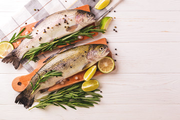 Seafood. Two raw rainbow trouts marinated with lime, rosemary