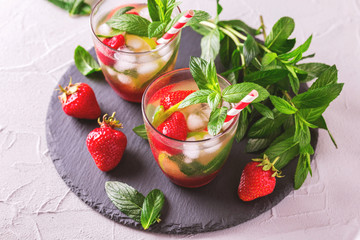 Cold lemonade with fresh strawberry, mint, lime and jam