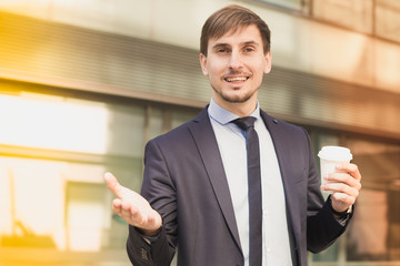 Portrait of cheerful male standing outdoor