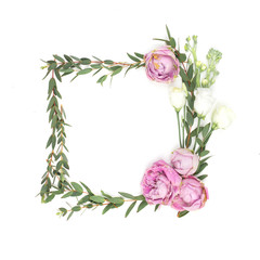 Frame from flowers with place for text with pink and white roses, leaves and petals, isolated on white background. Top view. Flat lay