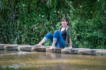 Fototapeta na wymiar woman enjoying in the river