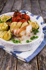 Baked fish with vegetables