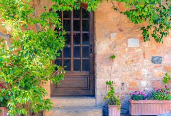 Fototapeta na wymiar Facade of an italian building in Bolgheri, Castagneto Carducci, Tuscany, Italy