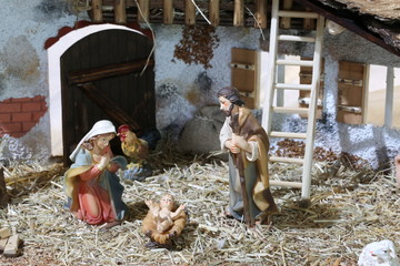nativity scene with holy family in a stall