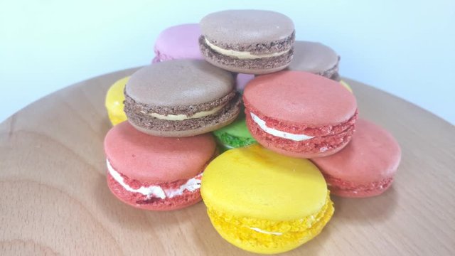 Great background of  macaroons rotating on wooden stand close up. 
Footage will work great for any videos dealing with sweet-shop, childhood, gladness and much more.
