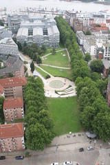 Beautiful view of famous Hamburger Landungsbruecken with commercial harbor and Elbe river with blue sky and clouds in summer, St. Pauli district, Hamburg, Germany