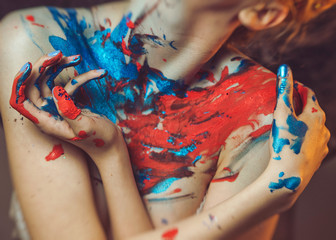 girl with fancy makeup in red and blue colors