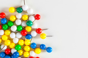 colorful color push pins isolated on white background