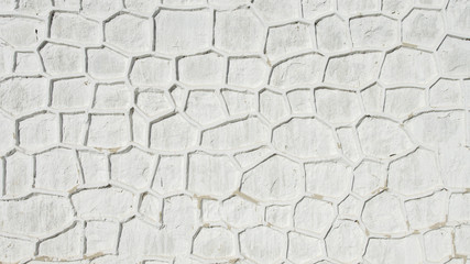 handmade wall with white raw cement and stone