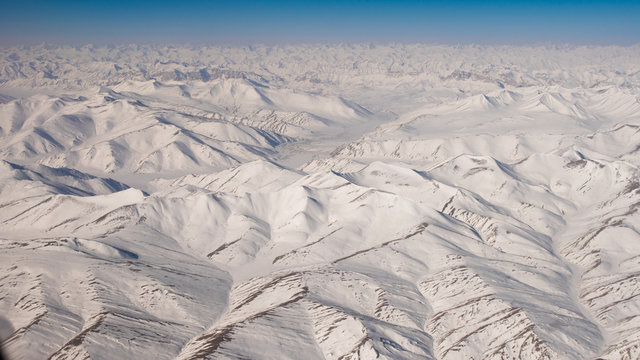 Fototapeta top view of white snow mountain 