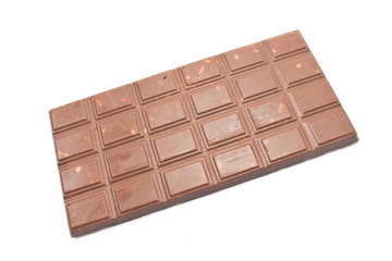 Chocolate bar with crumbled biscuits isolated on white