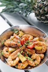 stir fry prawns in spicy asian pineapple and herbs sauce