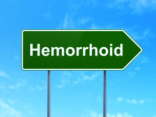 Healthcare concept: Hemorrhoid on road sign background