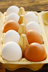 2 difference color of eggs.
Many eggs in package with morning light.