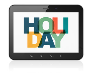 Holiday concept: Tablet Computer with Holiday on  display