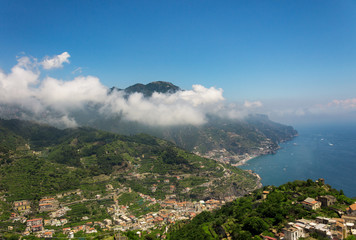 Fototapeta na wymiar View from the hill of Ravello with mountain, clouds and sea coast of Amalfi, Italy