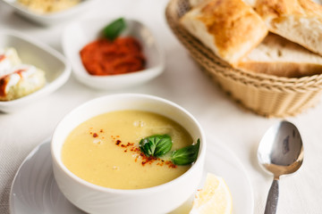 Lentils soup served on the table in turkish restaurant