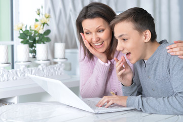 mother and son with laptop
