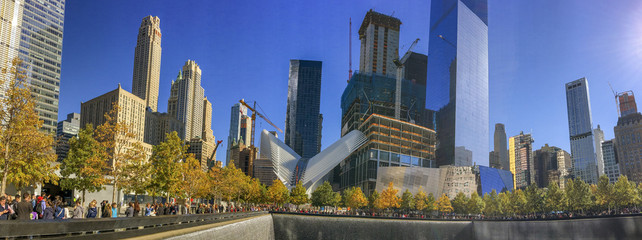 NEW YORK CITY - OCTOBER 2015: Tourists walk along city skyline. New York attracts 50 million people annually