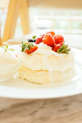 Pancake with ice cream strawberry , blueberry and raspberry