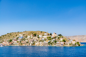 Naklejka na ściany i meble Colourful, picturesque houses at Symi island, Greece