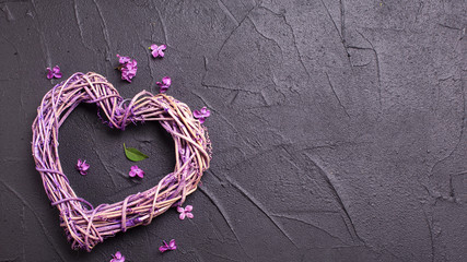 Heart on  black textured background.