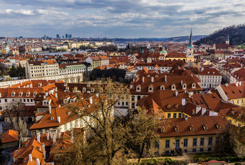 Fototapeta na wymiar View from above from the observation platform of the royal castle Hradcany on the old streets. Area of the Old City. Prague, Czech Republic.