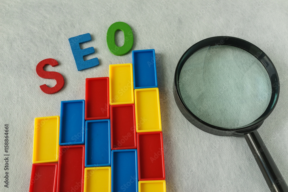 Poster search engine optimization concept as colorful plastic blocks as analysis chart with alphabet abbrev