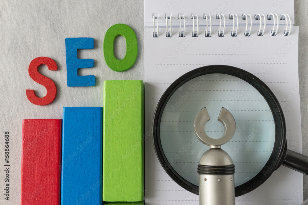 Aufkleber search engine optimization concept as colorful wooden block as analysis chart with alphabet abbrevia