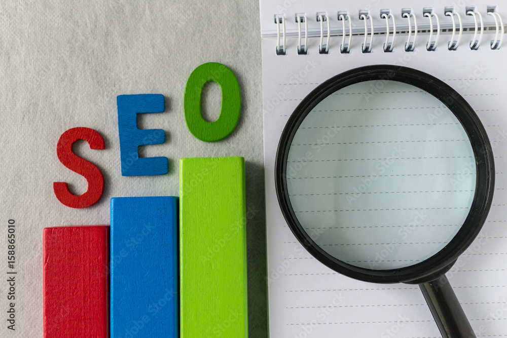 Aufkleber search engine optimization concept as colorful wooden block as analysis chart with alphabet abbrevia