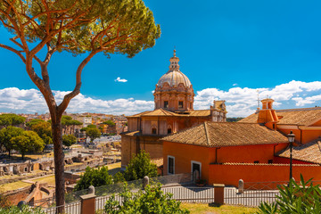 Fototapeta premium The Baroque church of Santi Luca e Martina with the remains of the Roman Forum in the sunny day in Rome, Italy