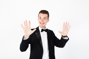 Young man master performing on the stage. Man in black suit on white background with copy space