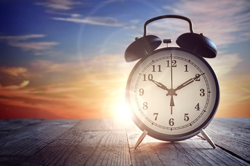 Alarm clock at sunset - Powered by Adobe
