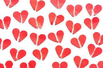 Festive background made from heap of broken red hearts