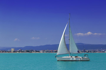 Sailing yacht in to the sea in summer

