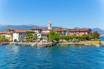 Fototapeta na wymiar Stresa, Verbania, Italy - April 21, 2017: View of Island Fishermen; the Borromean Islands of Lake Maggiore in Piedmont, Italy.
