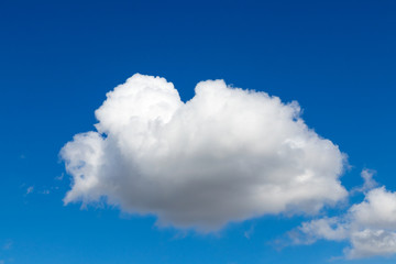 Naklejka na ściany i meble Fluffy clouds abstract shape in the blue sky.